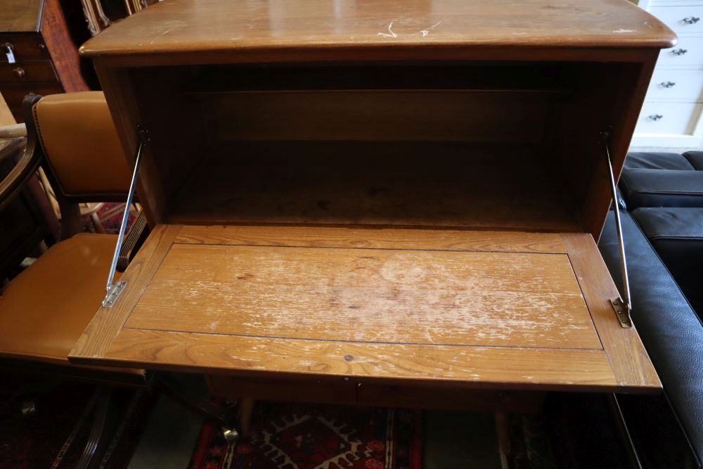 An Ercol cocktail cabinet, width 98cm, depth 46cm, height 150cm